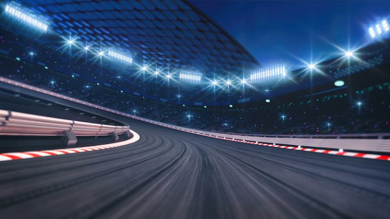 wide race track under lights at night